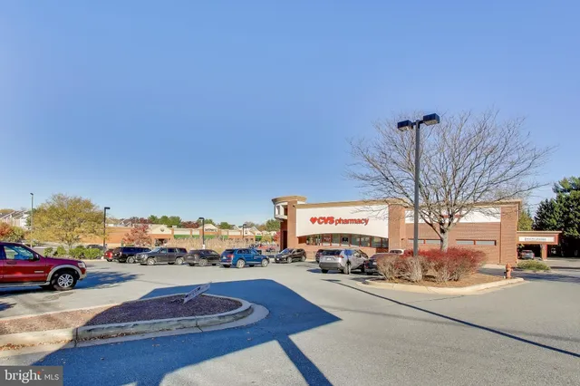 a view of a swimming pool with a table and chairs