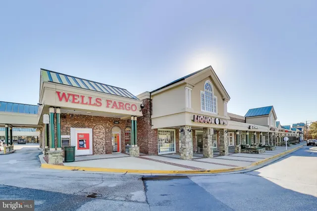 a picture of a bench in front of a wall