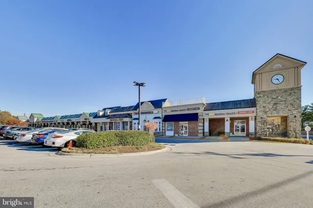 a picture of a bathroom with a shower and a mirror