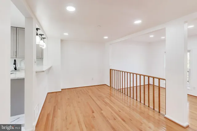 a view of hallway with wooden floor