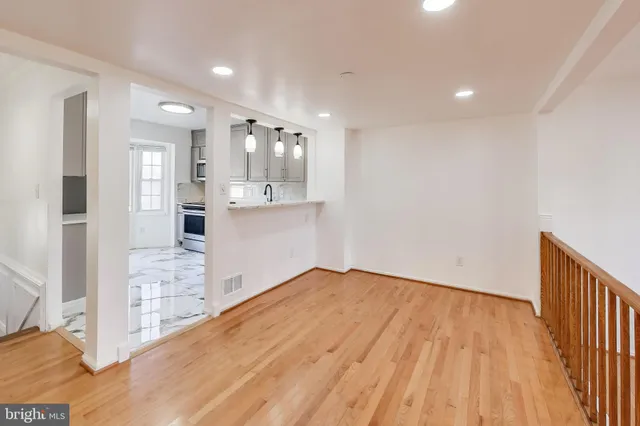 a view of kitchen with wooden floor