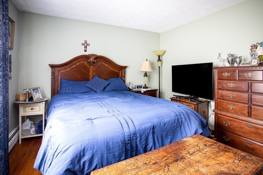 166 Stonehaven Road Fall River, MA 02723 - Photo 14 of 33 a bedroom with a bed and a flat screen tv
