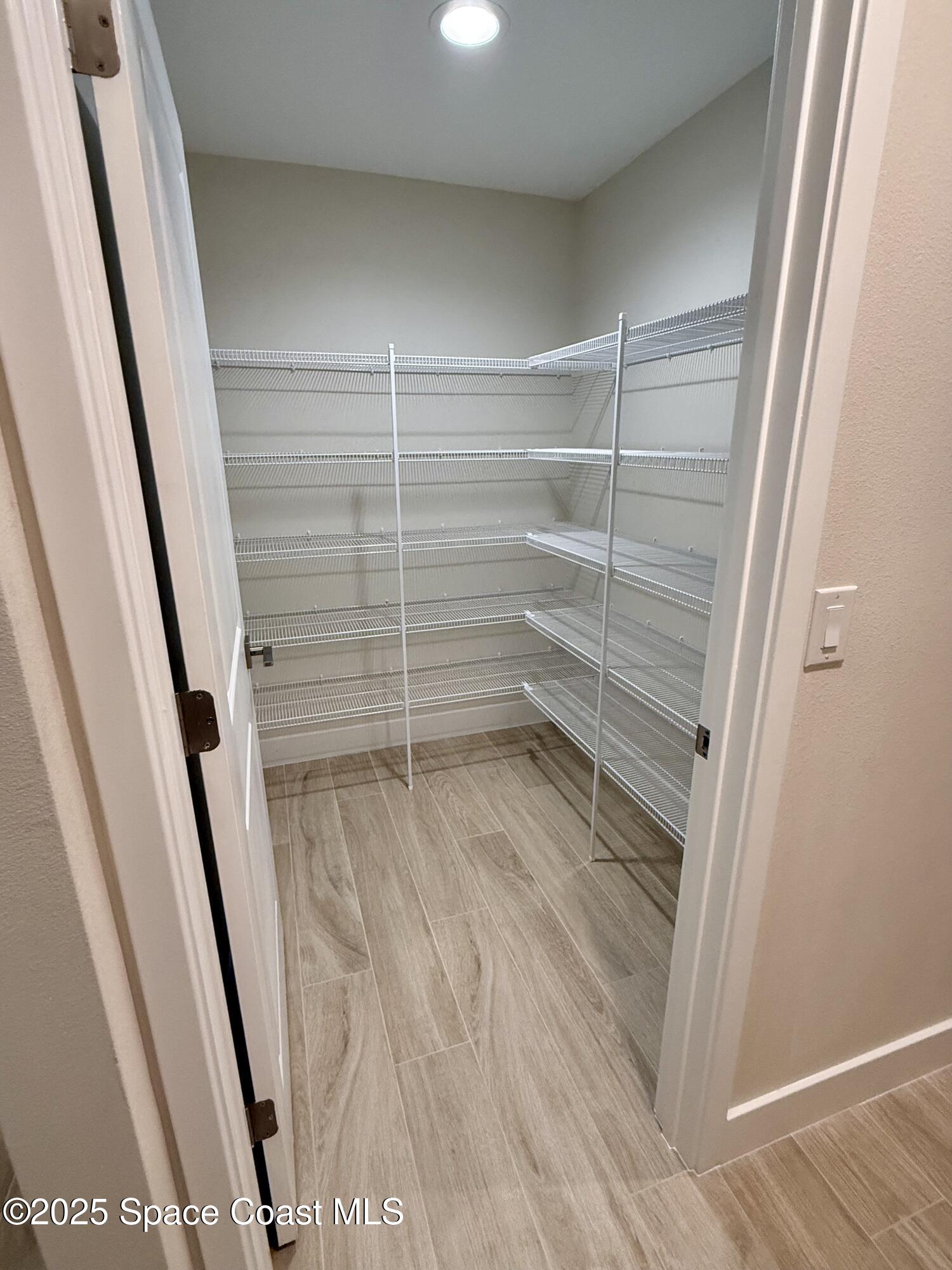 581 Toynbee Road Palm Bay, FL 32908 - Photo 11 of 25 a view of walk in closet with empty racks