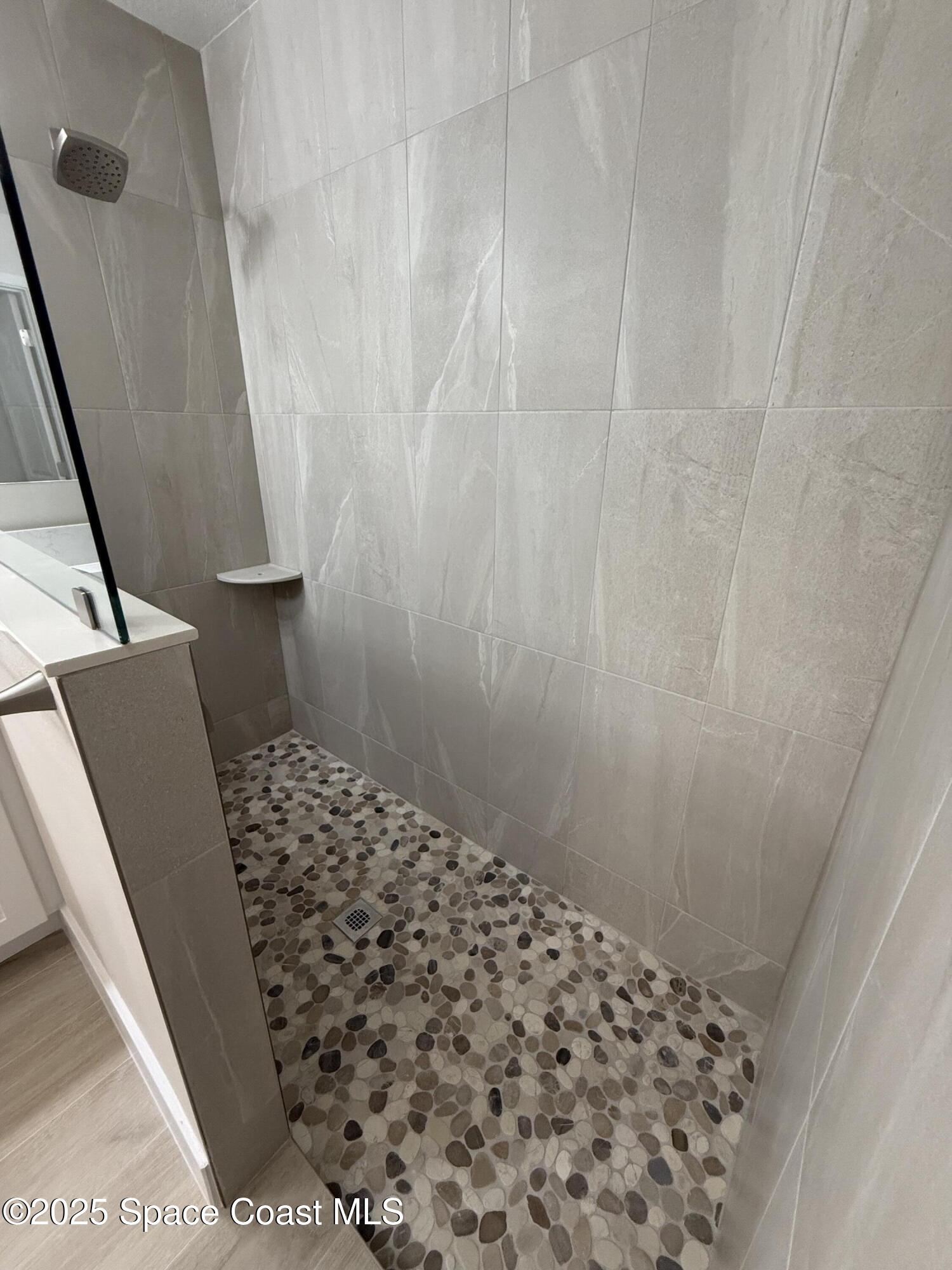 581 Toynbee Road Palm Bay, FL 32908 - Photo 17 of 25 a bathroom with a sink and a toilet