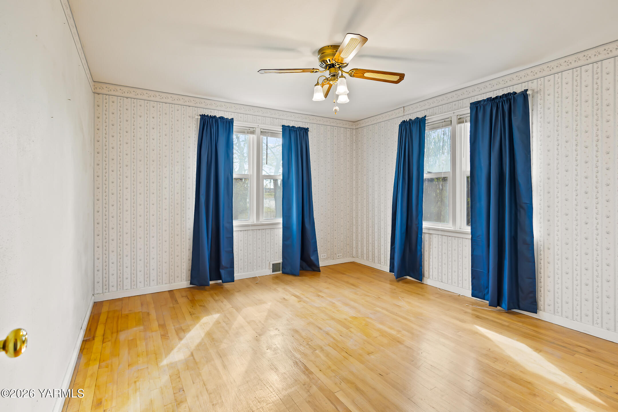 505 Schooley Road Zillah, WA 98953 - Photo 13 of 39 a bedroom with a large bed and a chandelier