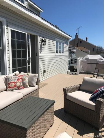 16 Cape Road Amityville, NY 11701 - Photo 24 of 27 Wooden terrace featuring an outdoor hangout area