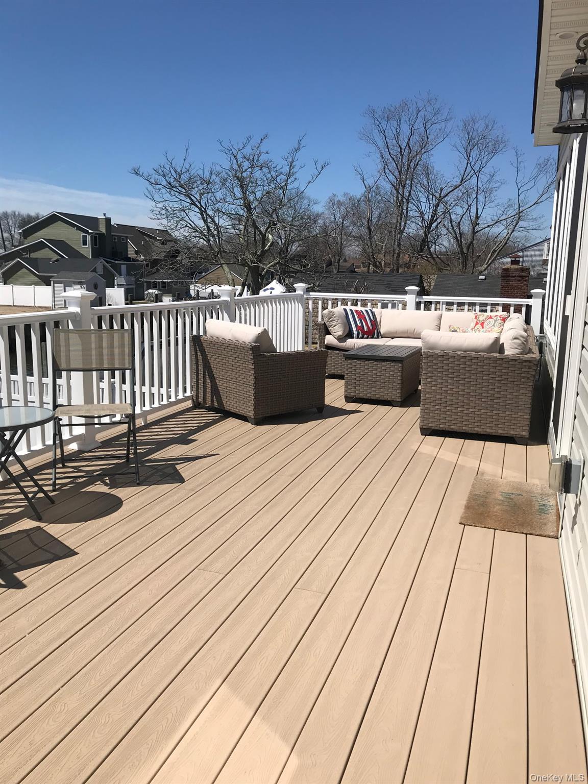 16 Cape Road Amityville, NY 11701 - Photo 26 of 27 Wooden terrace featuring an outdoor living space