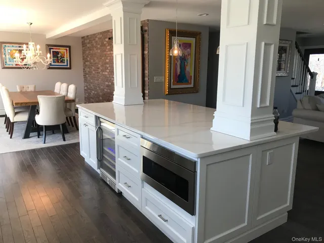 a view of living room with furniture and wooden floor