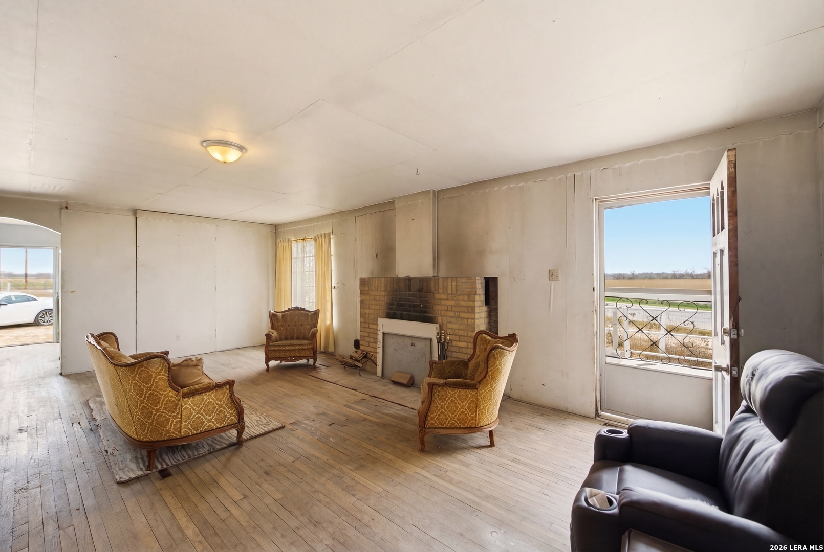 4988 South Loop 1604 East Elmendorf, TX 78112 - Photo 13 of 31 a living room with furniture and a window