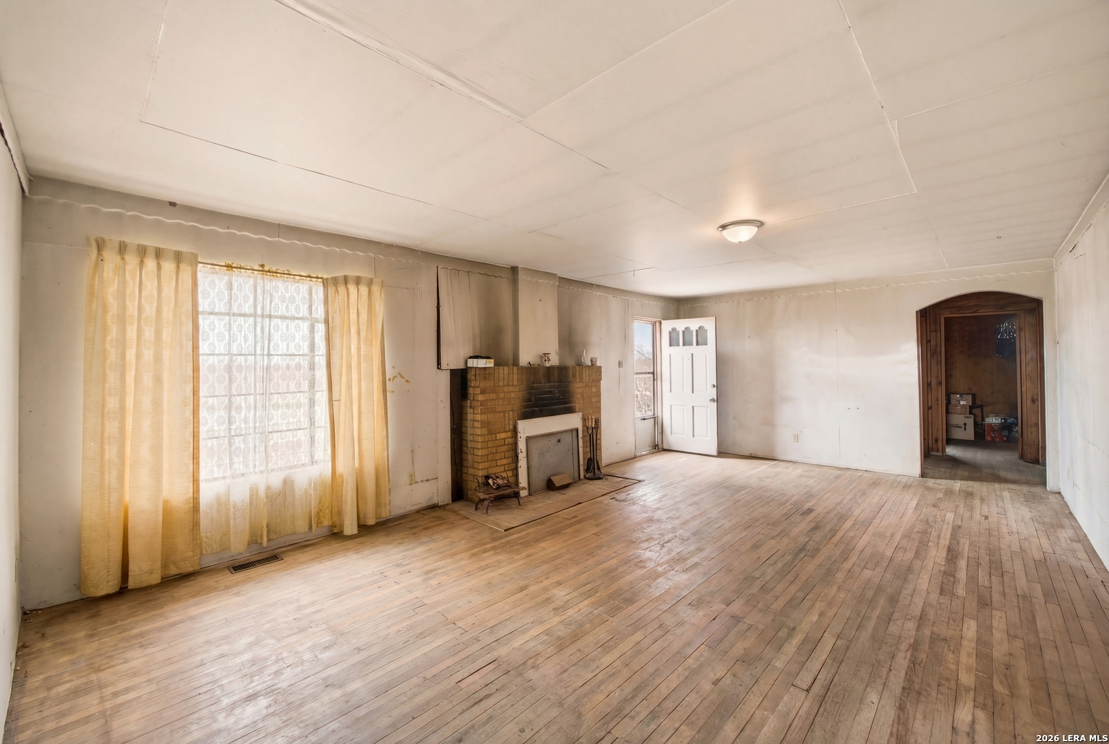 4988 South Loop 1604 East Elmendorf, TX 78112 - Photo 14 of 31 a view of empty room with wooden floor and fan