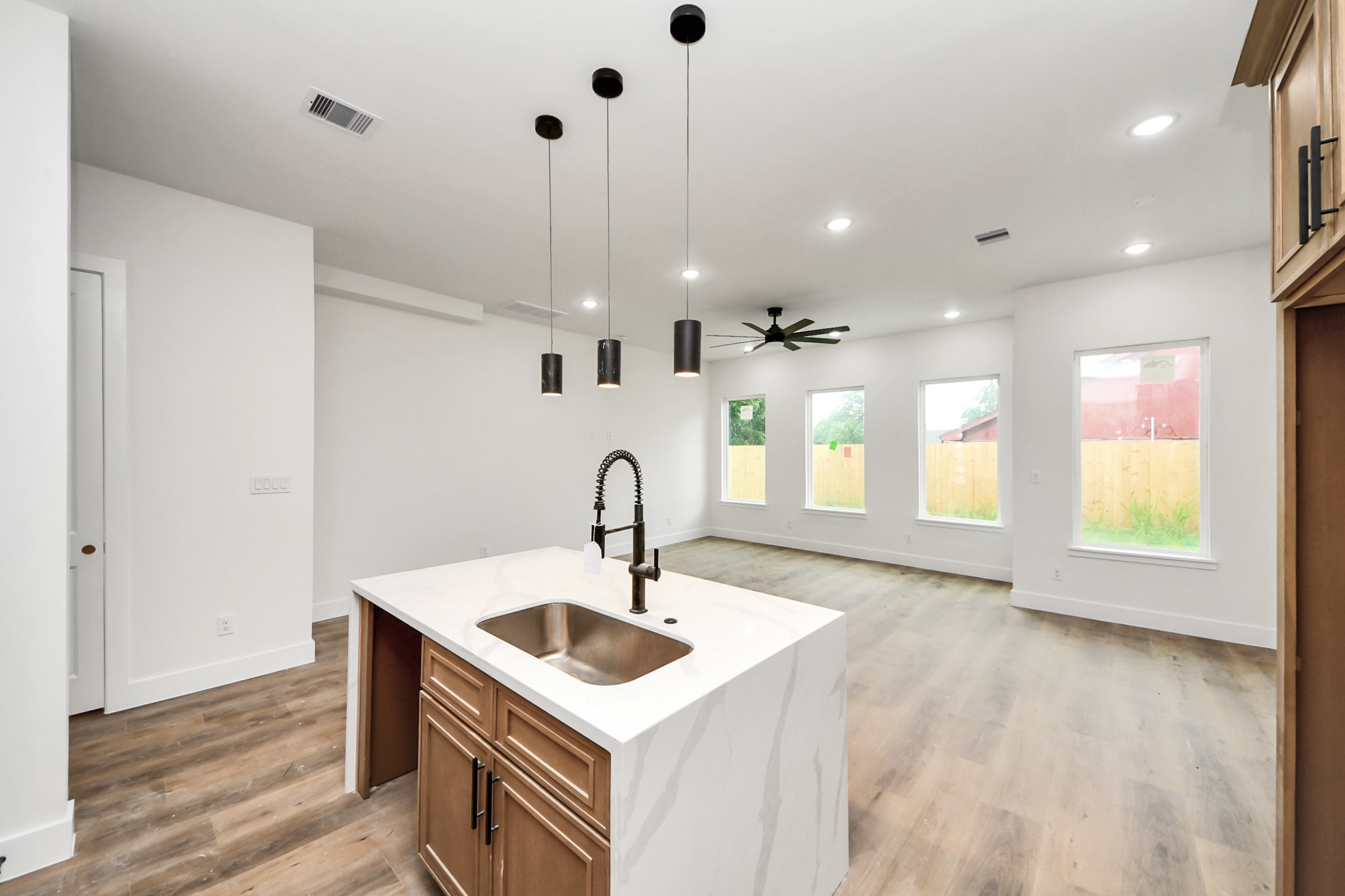 8206 Colonial Lane Houston, TX 77051 - Photo 15 of 31 a kitchen with a sink a window and wooden floor