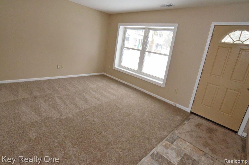 1211 Miniature Court Rochester, MI 48307 - Photo 7 of 12 Brand new carpet and flooring!