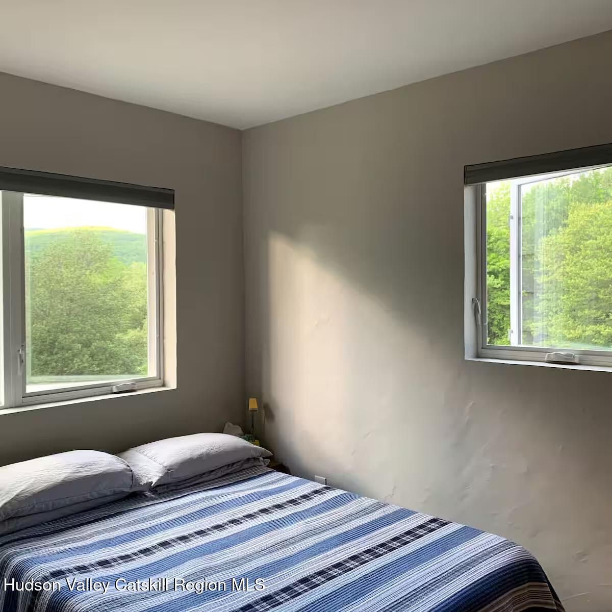 501 Cold Brook Road Bearsville, NY 12409 - Photo 3 of 10 a bedroom with a bed and a window