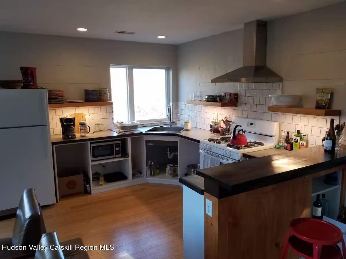 501 Cold Brook Road Bearsville, NY 12409 - Photo 4 of 10 a kitchen with stainless steel appliances a sink stove and refrigerator
