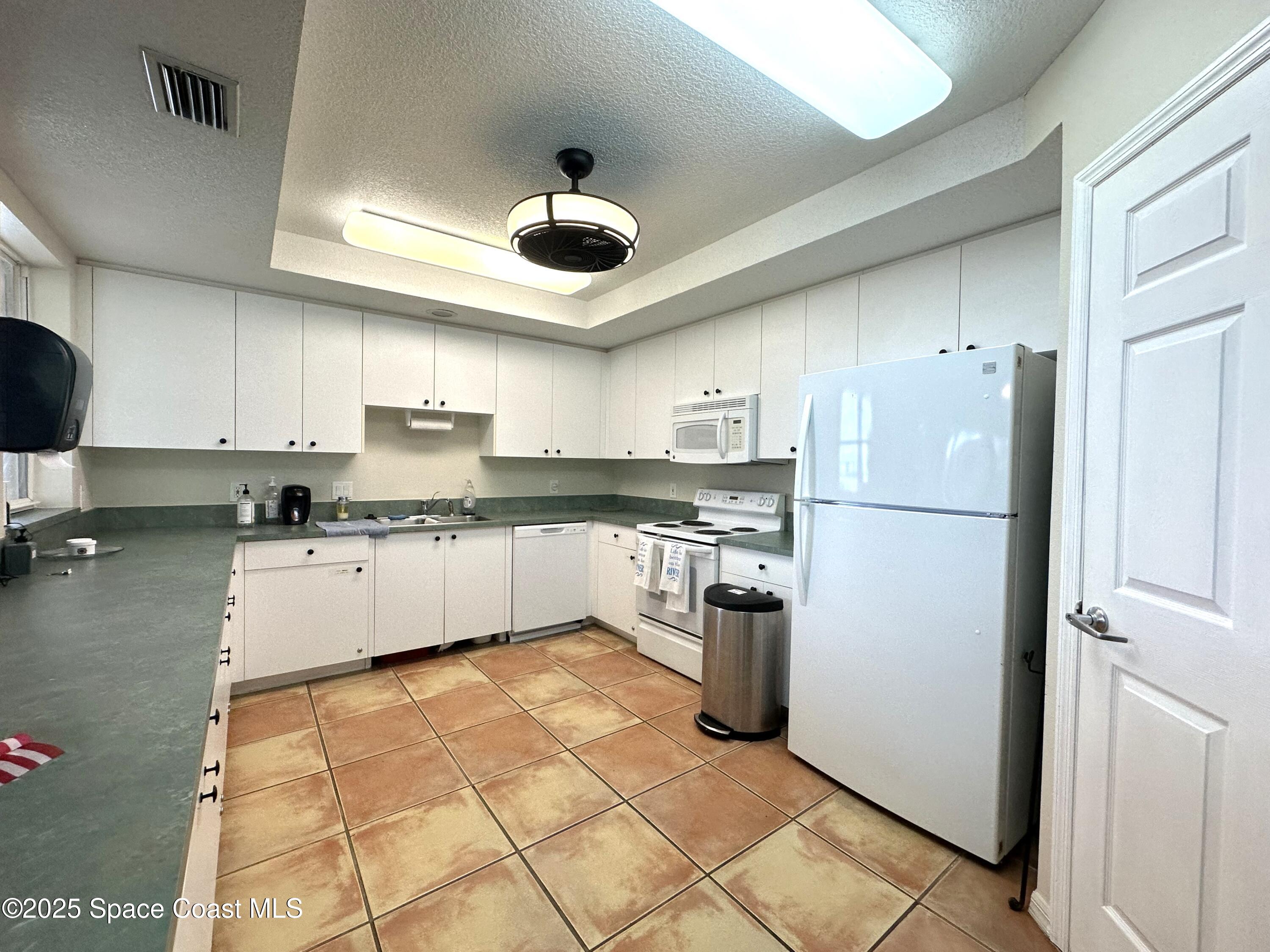 102 Riverside Drive, Unit B503 Cocoa, FL 32922 - Photo 33 of 50 Oleander Pointe Clubhouse Kitchen