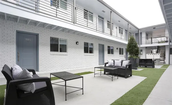 a backyard of a house with seating space