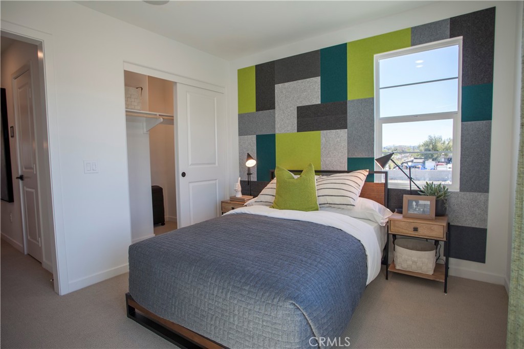 668 Panorama Lane La Puente, CA 91744 - Photo 11 of 13 a bedroom with a bed a table and windows
