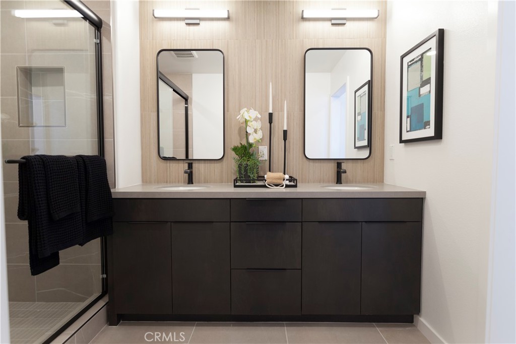 668 Panorama Lane La Puente, CA 91744 - Photo 9 of 13 a bathroom with double vanity sinks and a mirror