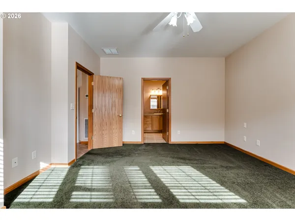 a view of an empty room and window