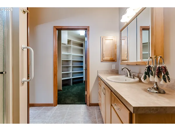 a bathroom with a sink double vanity and a mirror