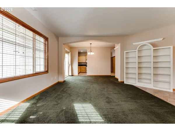 a view of an empty room with a window