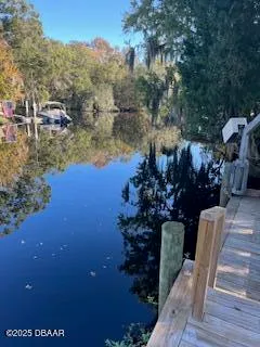 a view of a chairs and table in the patio