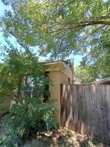 a view of backyard with green space