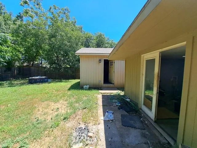 a backyard of a house with lots of green space