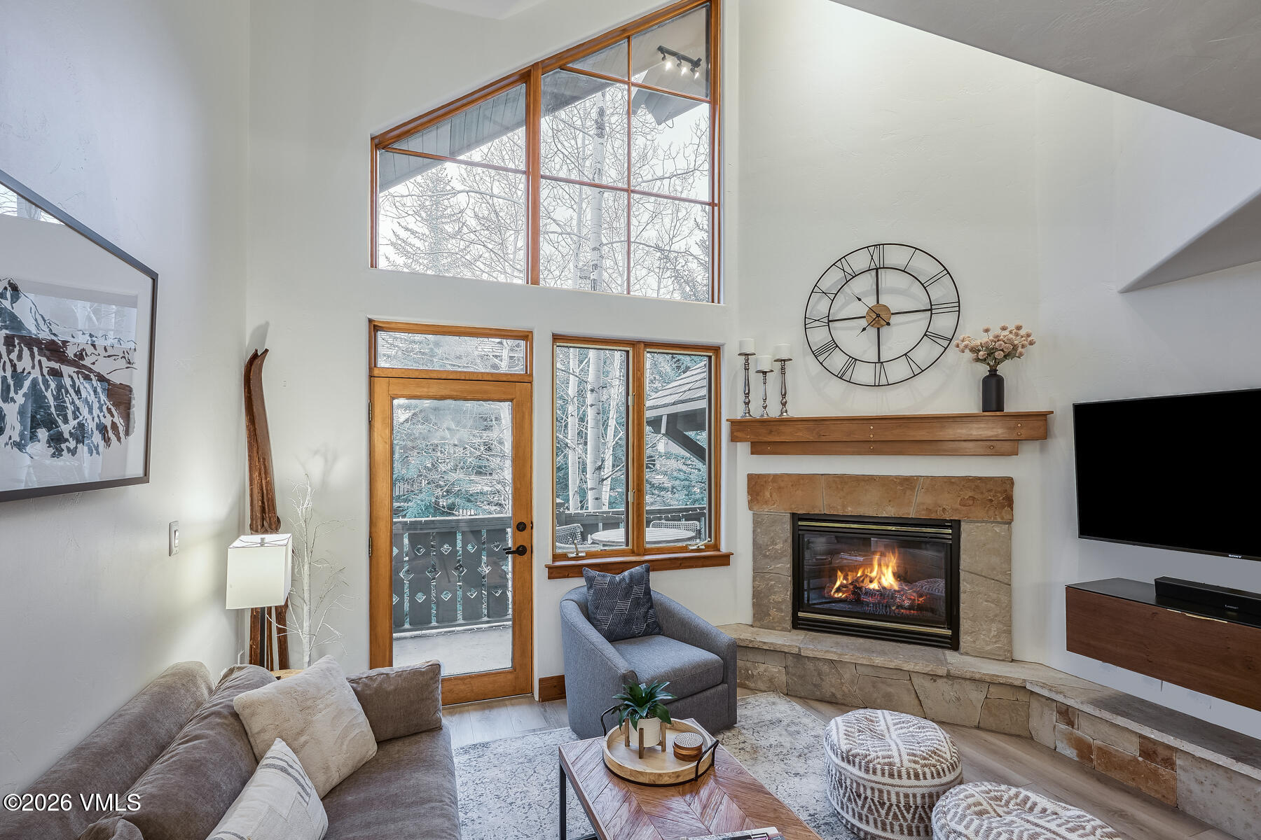 30 Cresta Road, Unit 306 Edwards, CO 81632 - Photo 7 of 26 a living room with furniture a fireplace and a flat screen tv