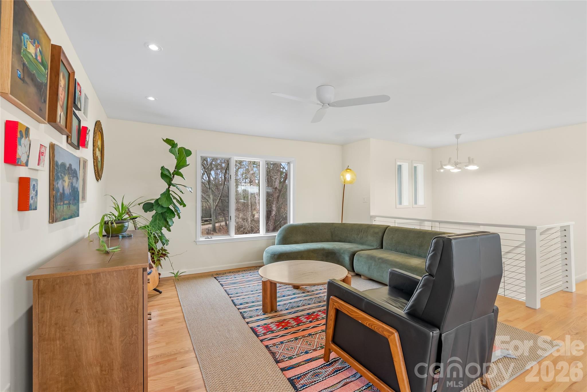 132 Snelson Cemetary Road Leicester, NC 28748 - Photo 6 of 34 a living room with furniture and a large window
