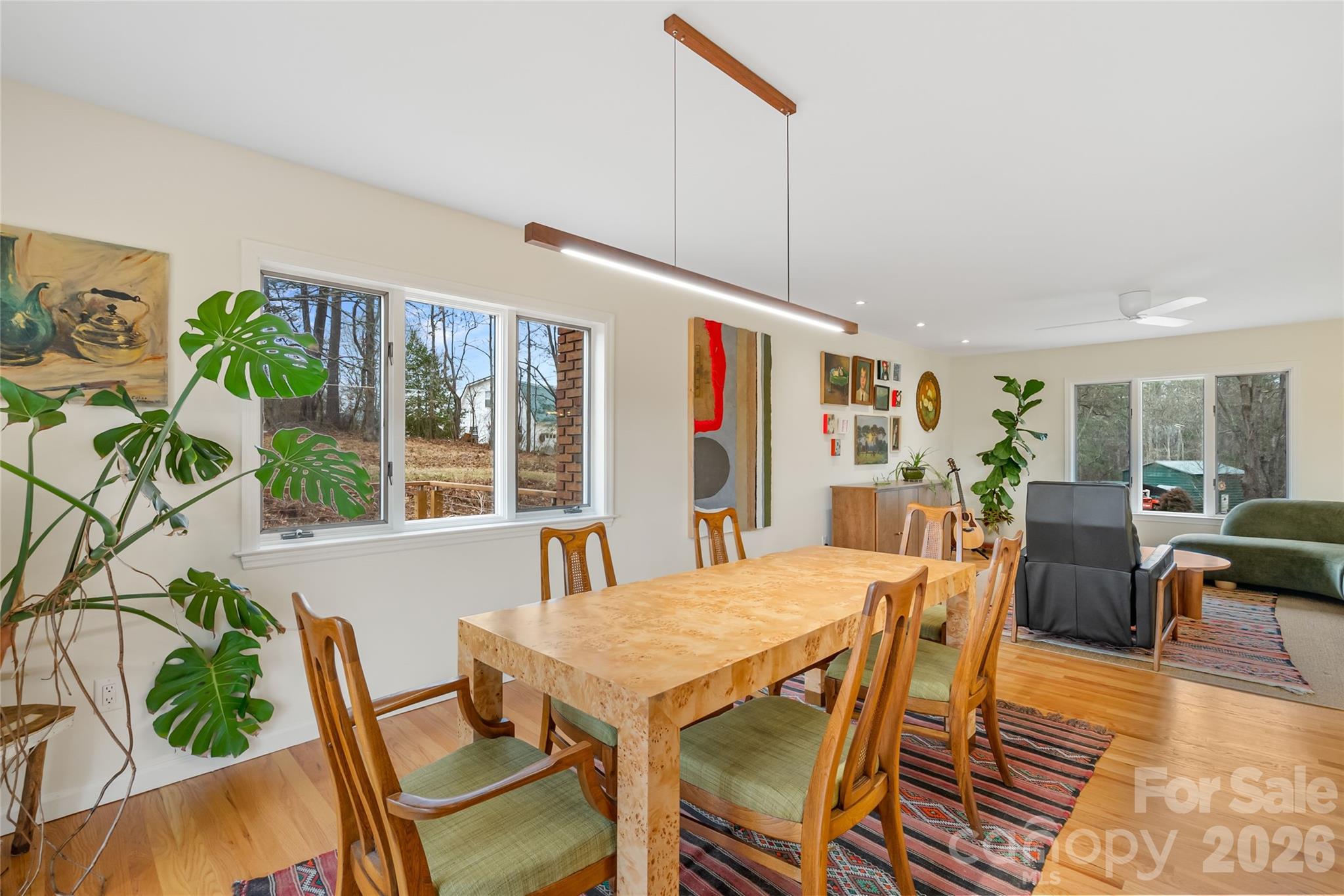 132 Snelson Cemetary Road Leicester, NC 28748 - Photo 7 of 34 a view of a dining room with furniture window and wooden floor