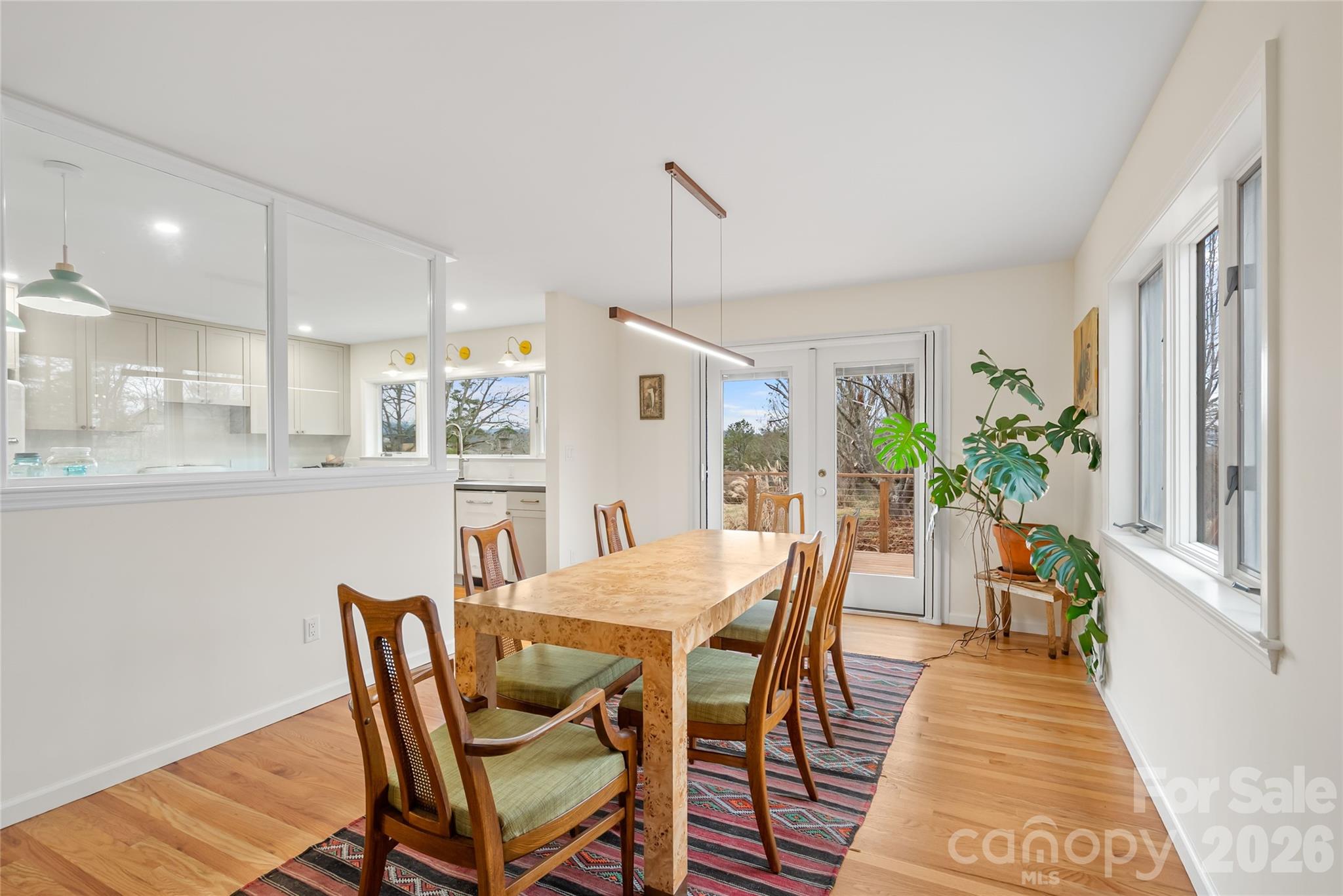 132 Snelson Cemetary Road Leicester, NC 28748 - Photo 8 of 34 a view of a dining room with furniture and wooden floor