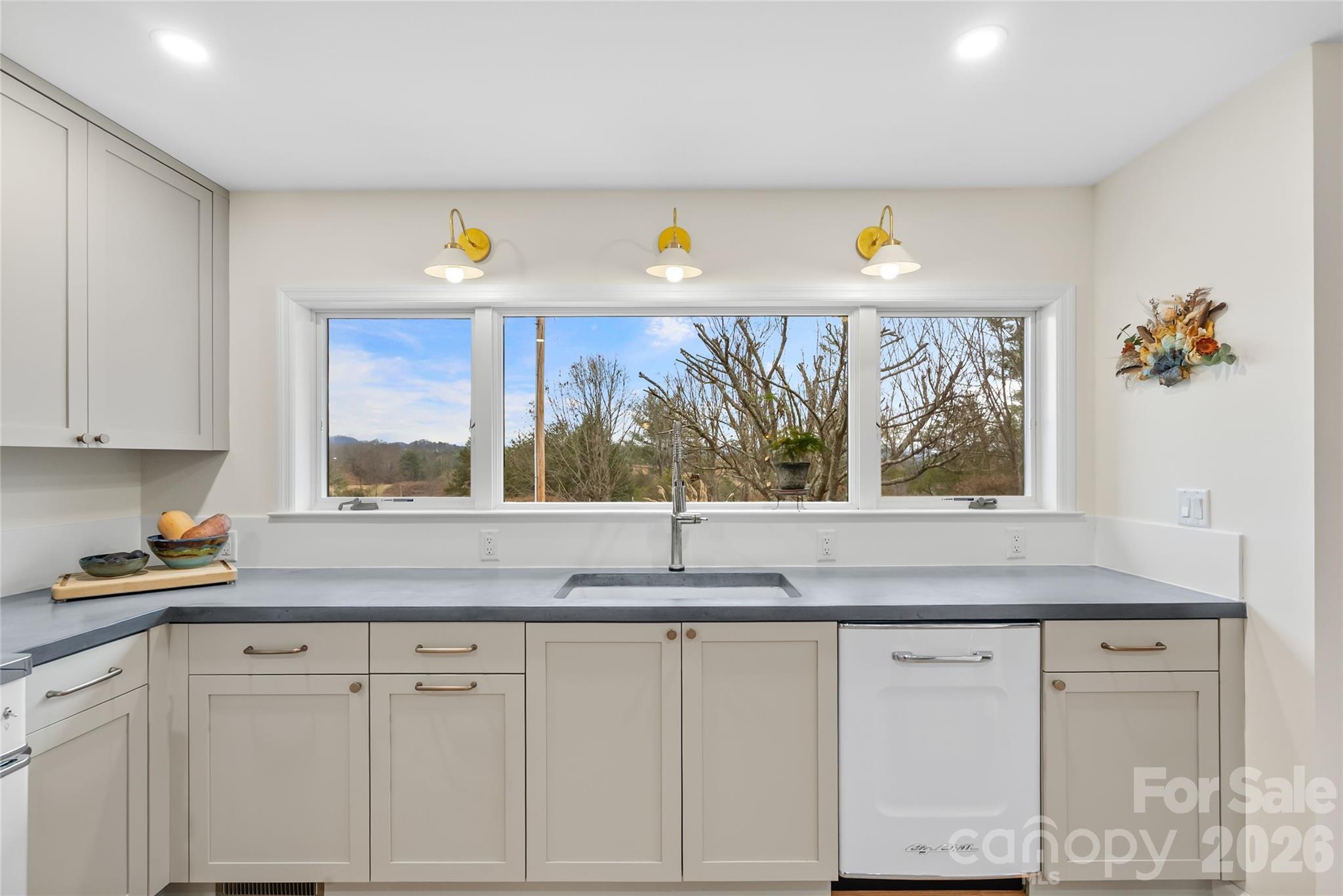132 Snelson Cemetary Road Leicester, NC 28748 - Photo 10 of 34 a kitchen with stainless steel appliances white cabinets and a granite counter tops