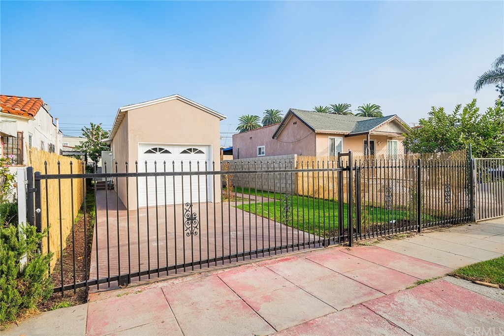 a view of a wrought iron fences in front of house