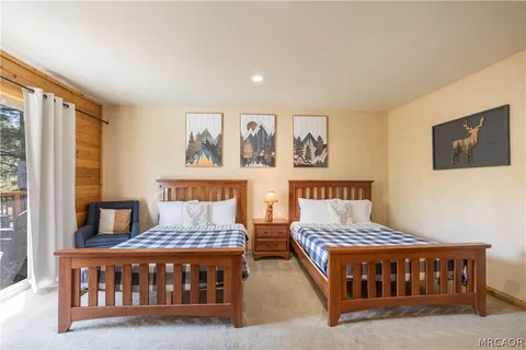 a bedroom with furniture and a window