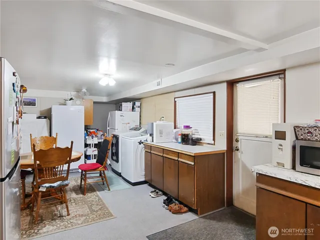 a view of a dining room with furniture and window