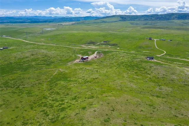a view of a field with an ocean