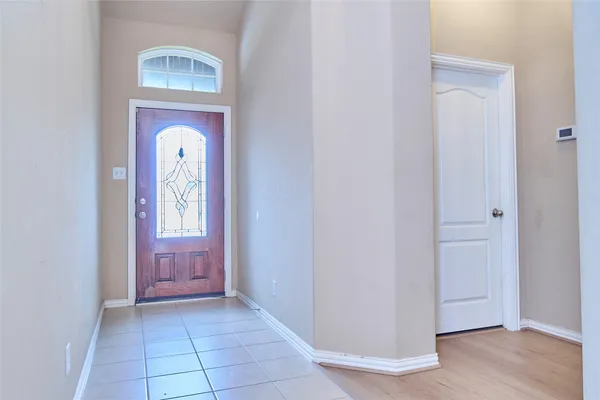 a view of a hallway with front door