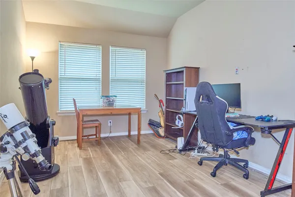 a workspace with furniture and a window