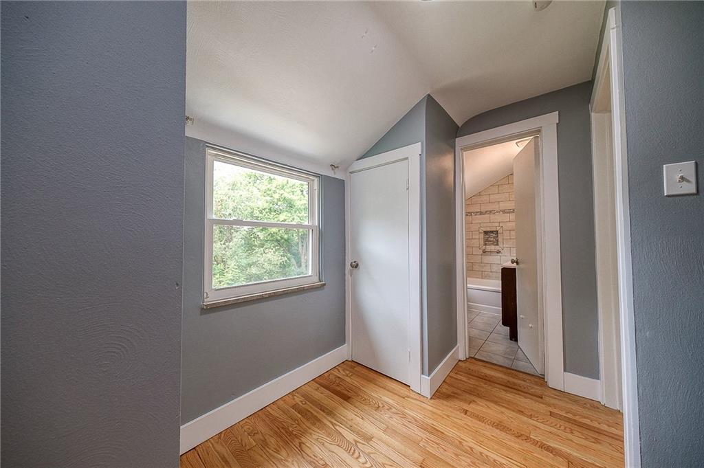 1015 McNeilly Road Pittsburgh, PA 15226 - Photo 13 of 29 a view of an empty room with wooden floor and a window