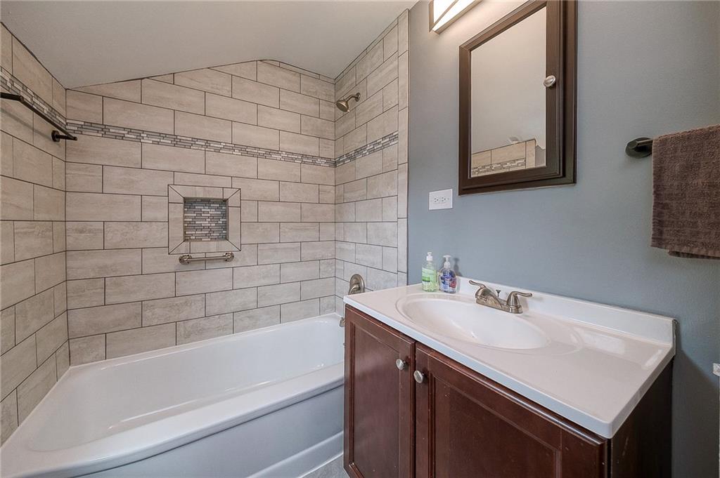 1015 McNeilly Road Pittsburgh, PA 15226 - Photo 20 of 29 a bathroom with a sink and a bathtub