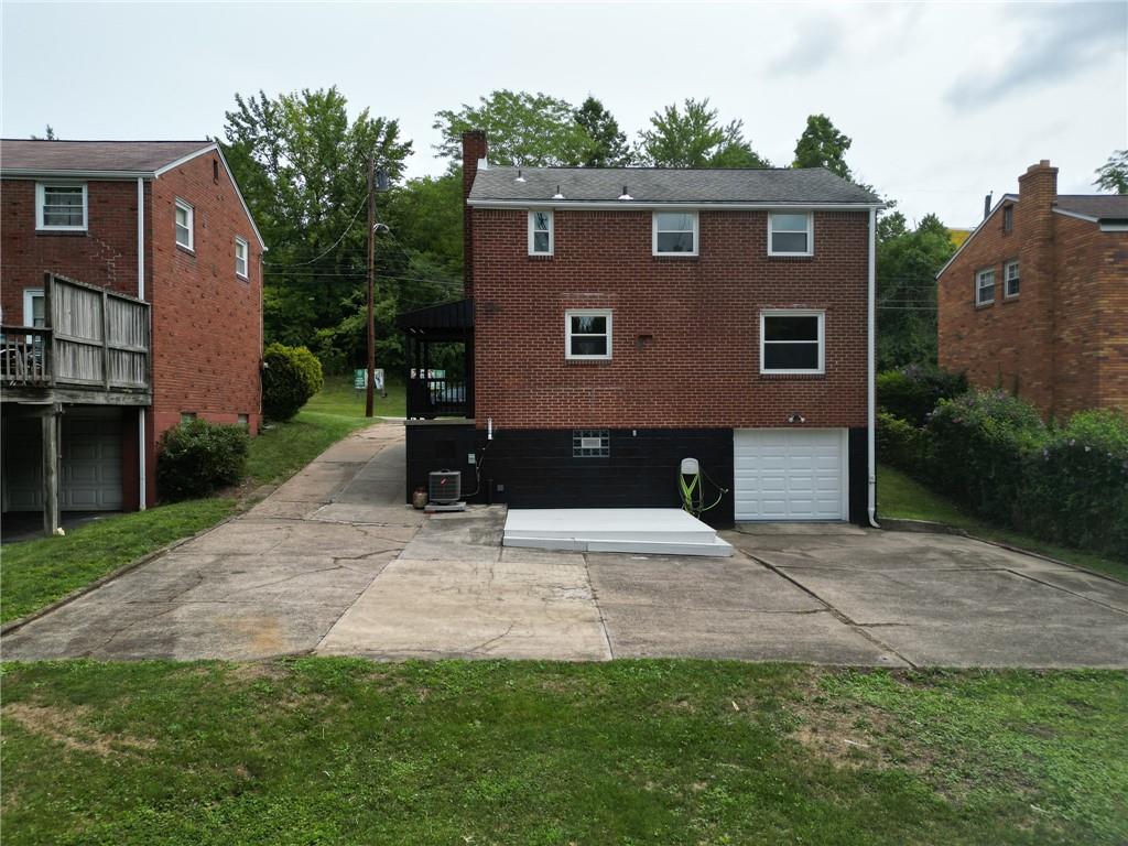 1015 McNeilly Road Pittsburgh, PA 15226 - Photo 28 of 29 a front view of a house with a yard