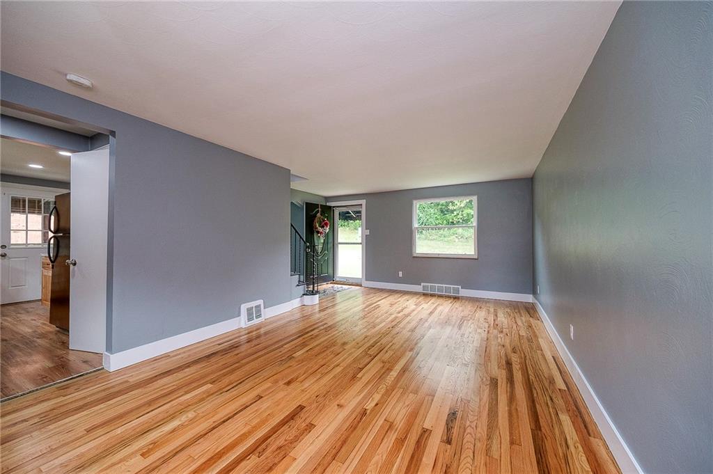 1015 McNeilly Road Pittsburgh, PA 15226 - Photo 5 of 29 wooden floor in an empty room with a window