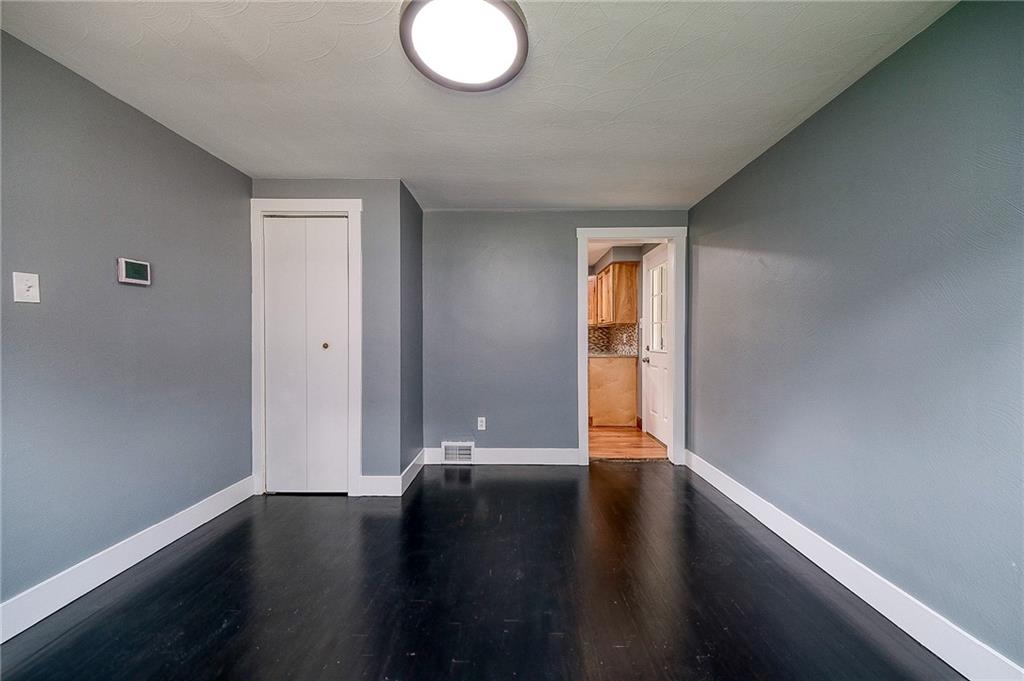 1015 McNeilly Road Pittsburgh, PA 15226 - Photo 9 of 29 a view of an empty room with wooden floor and a window