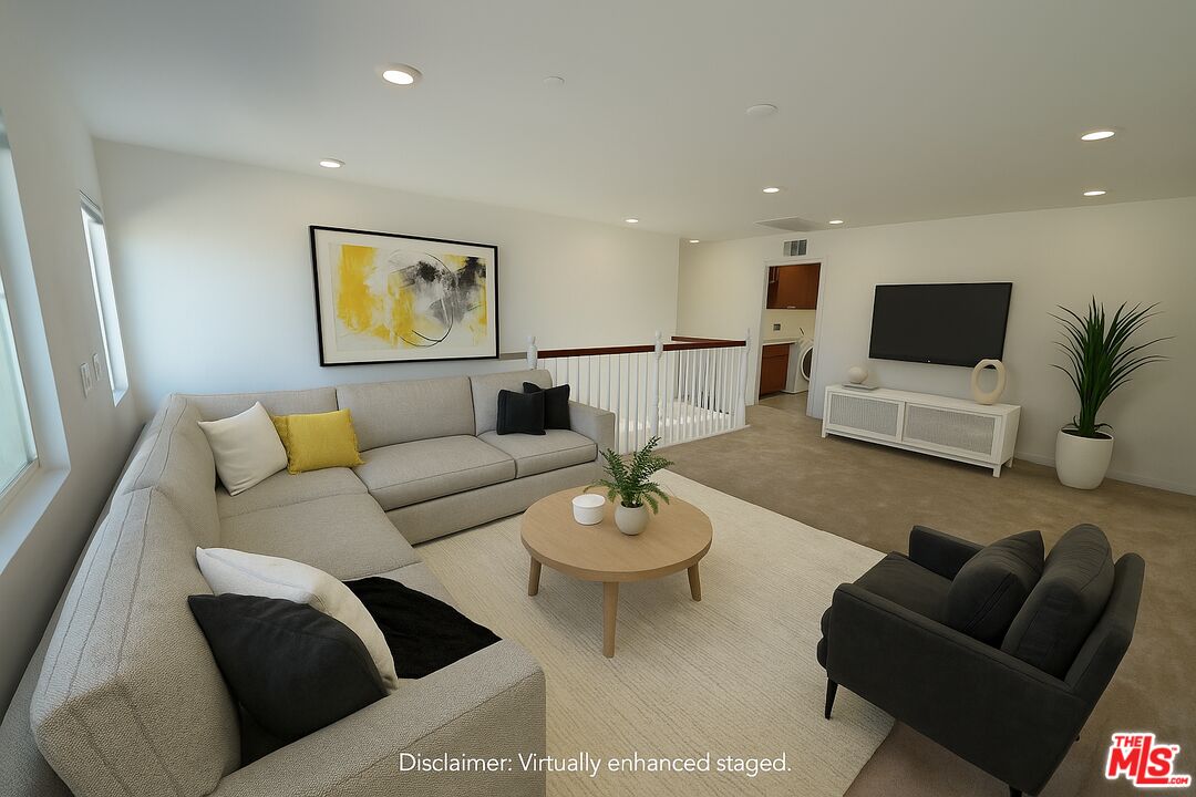 13233 Stanton Drive Rancho Cucamonga, CA 91739 - Photo 18 of 39 a living room with furniture and a flat screen tv