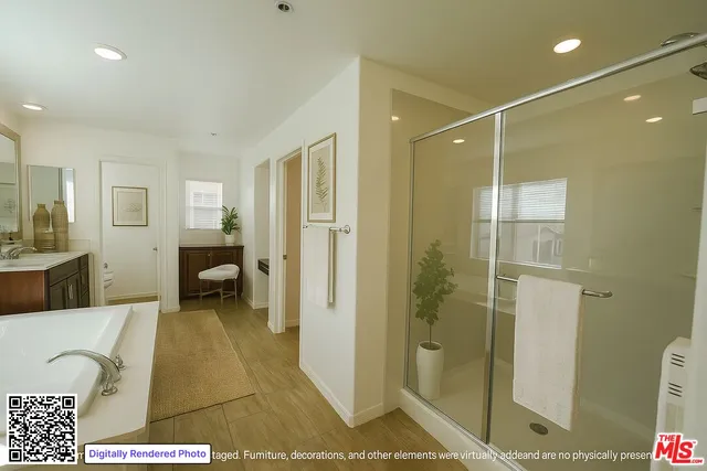 a spacious bathroom with a granite countertop sink a toilet a mirror and vanity