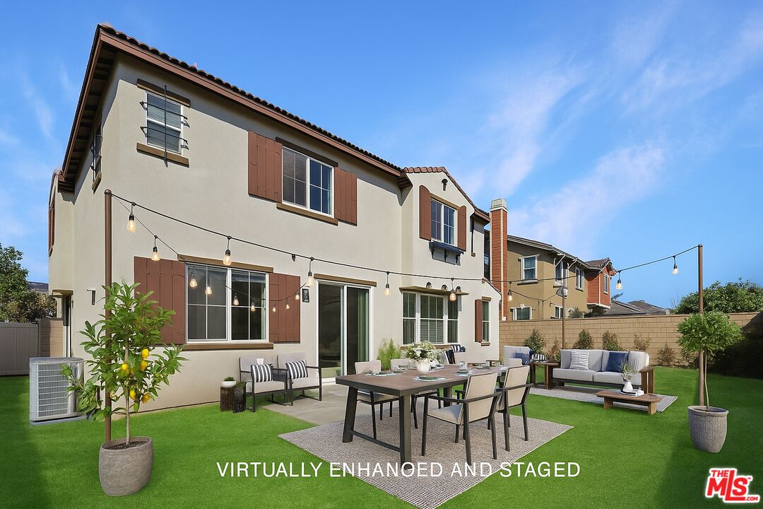 13233 Stanton Drive Rancho Cucamonga, CA 91739 - Photo 3 of 39 a backyard of a house with a garden and outdoor seating