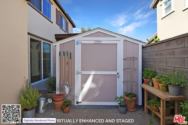 an aerial view of a house with garden space and street view