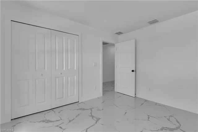 a bedroom with furniture and a couch