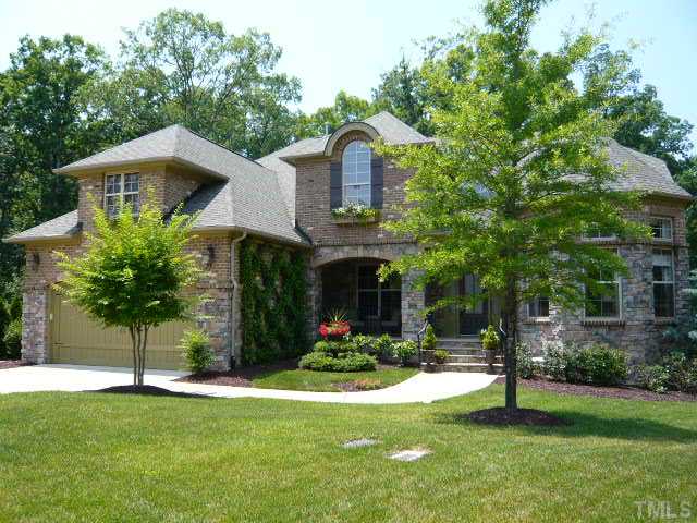 421 Rensford Place Cary, NC 27513 - Photo 1 of 25 a front view of a house with a yard